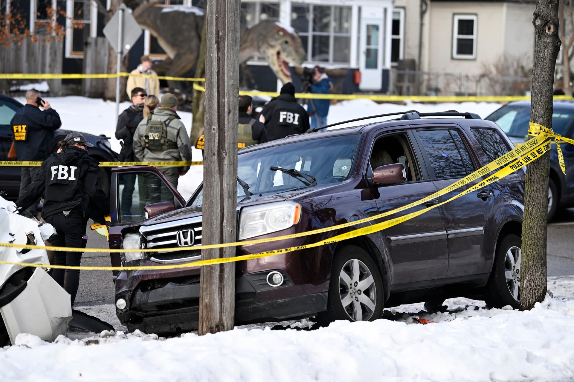 Stephen Maturen/Getty Images Law enforcement officers work the scene following a suspected shooting by an ICE agent at Minneapolis.