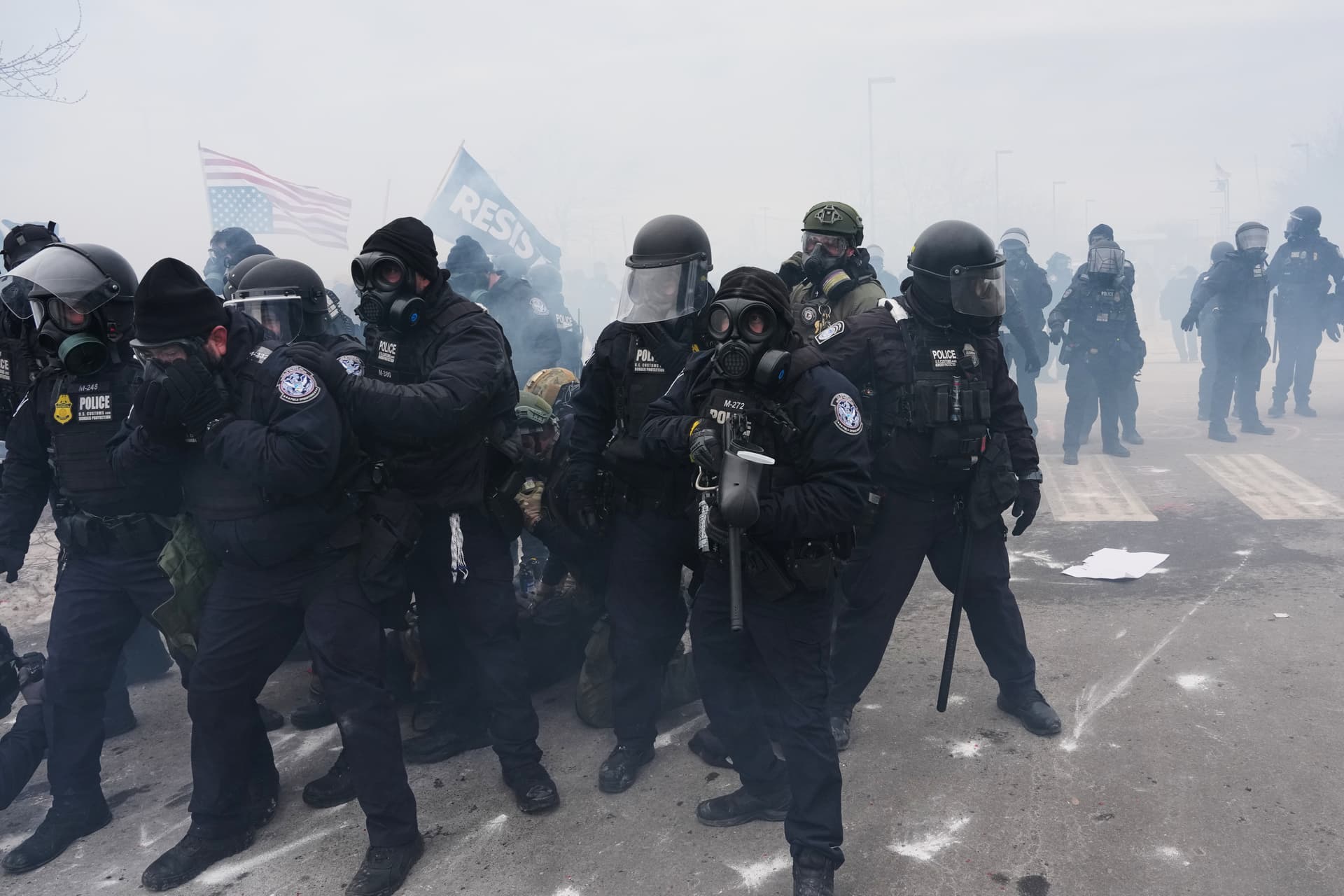 AP/Adam Gray Federal immigration officers confront protesters outside Bishop Henry Whipple Federal Building, January 15, 2026, at Minneapolis.