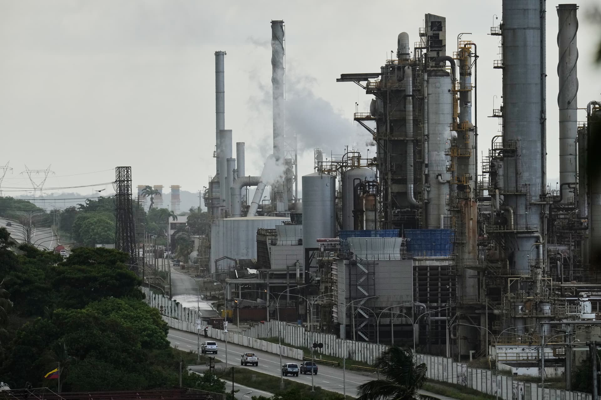 AP/Matias Delacroix Vehicles drive past the El Palito refinery in Puerto Cabello, Venezuela.