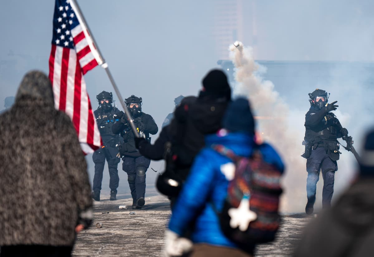 Stephen Maturen/Getty Images A Minneapolis Police officer throws a can of tear gas at people gathered on Nicollet Avenue after a fatal shooting by federal agents on January 24, 2026 in Minneapolis, Minnesota.
