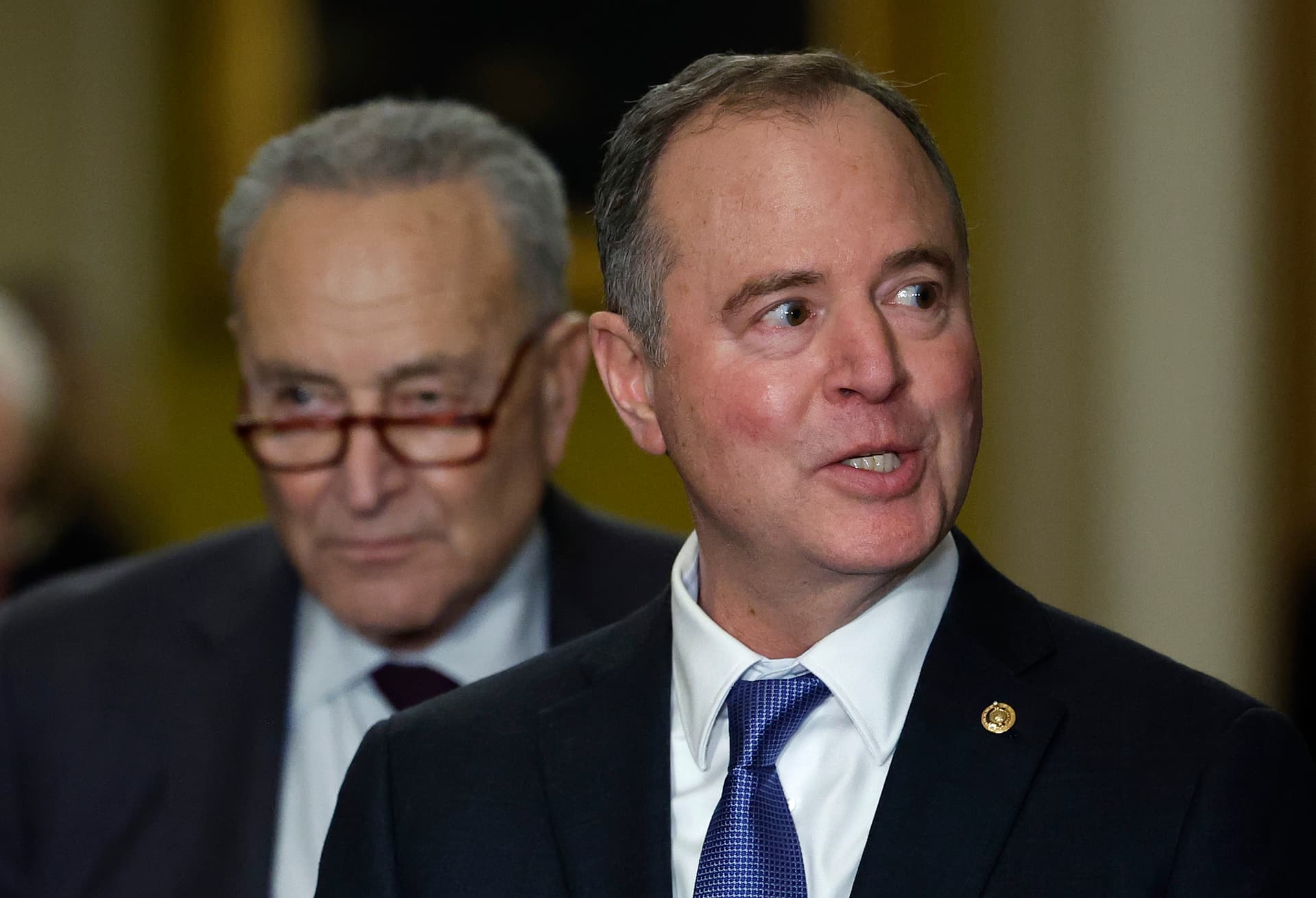 Kevin Dietsch/Getty Images Senators Adam Schiff, right, and Chuck Schumer, left, at the Capitol on December 10, 2024.