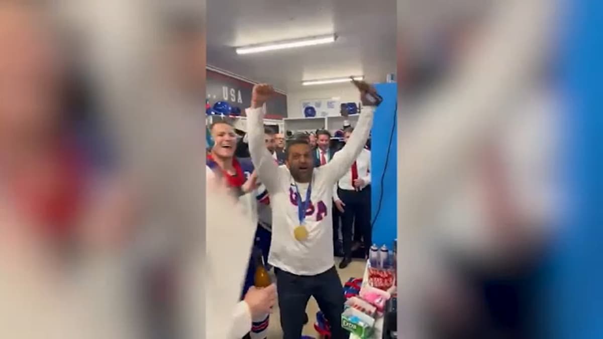YouTube Kash Patel celebrates with the American hockey team after their Olympic win.