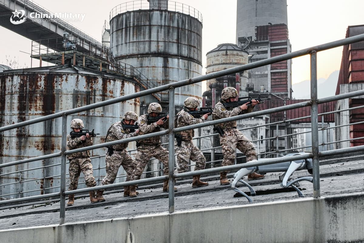eng.chinamil.com.cn/Photo by Wang Zhanming Soldiers assigned to the fifth detachment of the Chinese People's Armed Police (PAP) Force Chongqing Corps advance and search in coordination with a robotic dog during a search and annihilation combat training exercise on January 23, 2026.