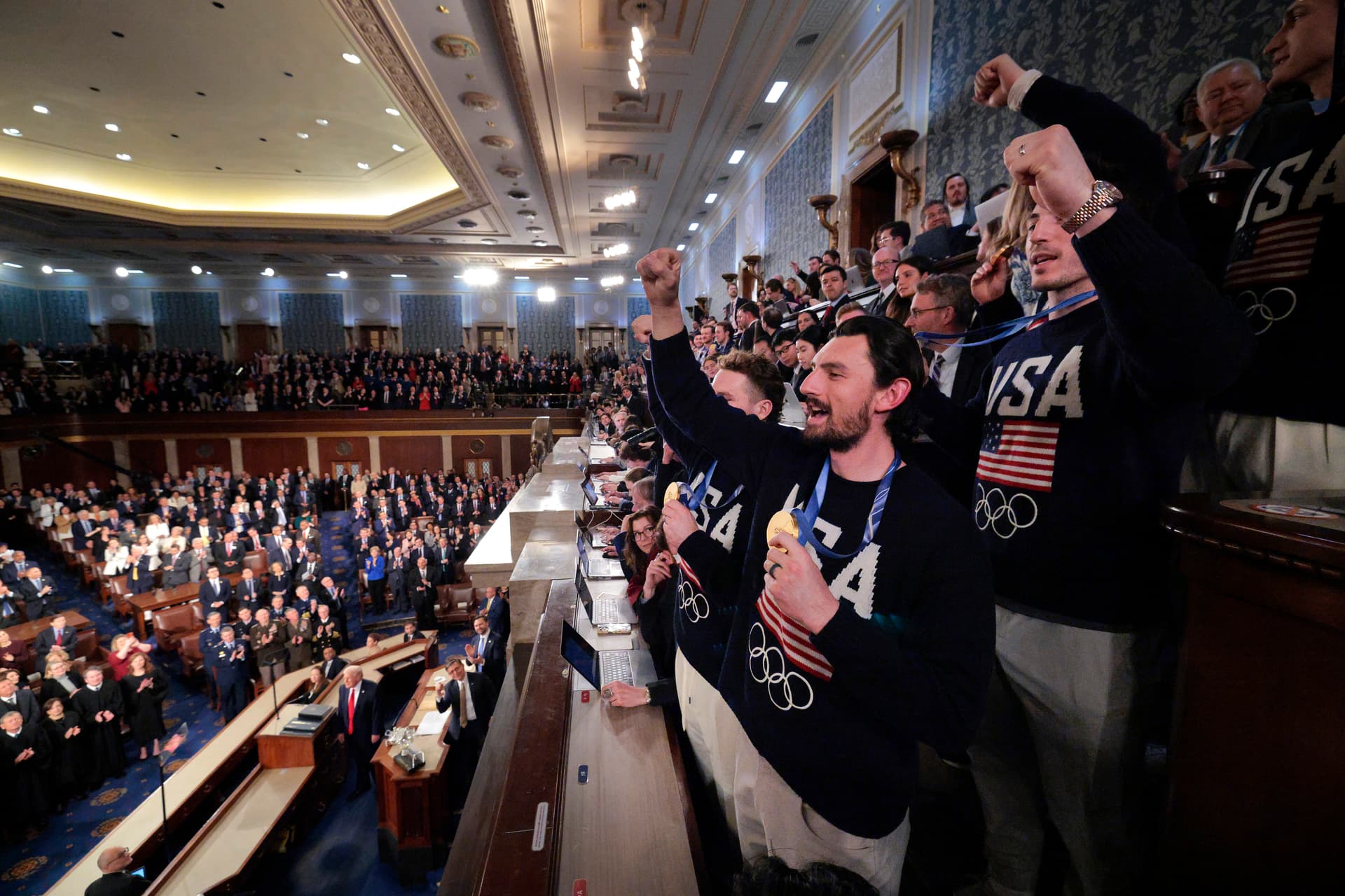 Chip Somodevilla/Getty Images Members of the Team USA men's hockey team wave to the audience as President Trump delivers his State of the Union address at the U.S. Capitol on February 24, 2026.