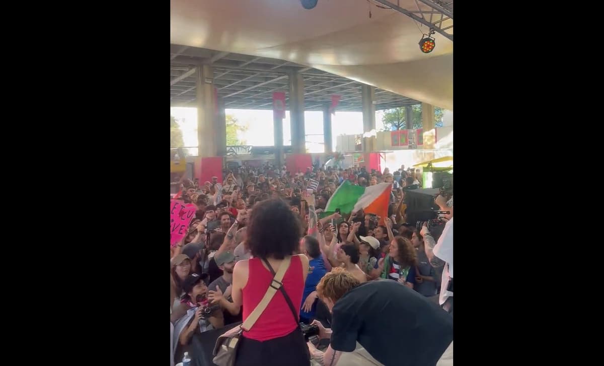 Kneecap via X Photographers take pictures from the stage of guests at a Kneecap concert in Cuba as the crowd erupts in a "Free Palestine" chant, March 21, 2026.