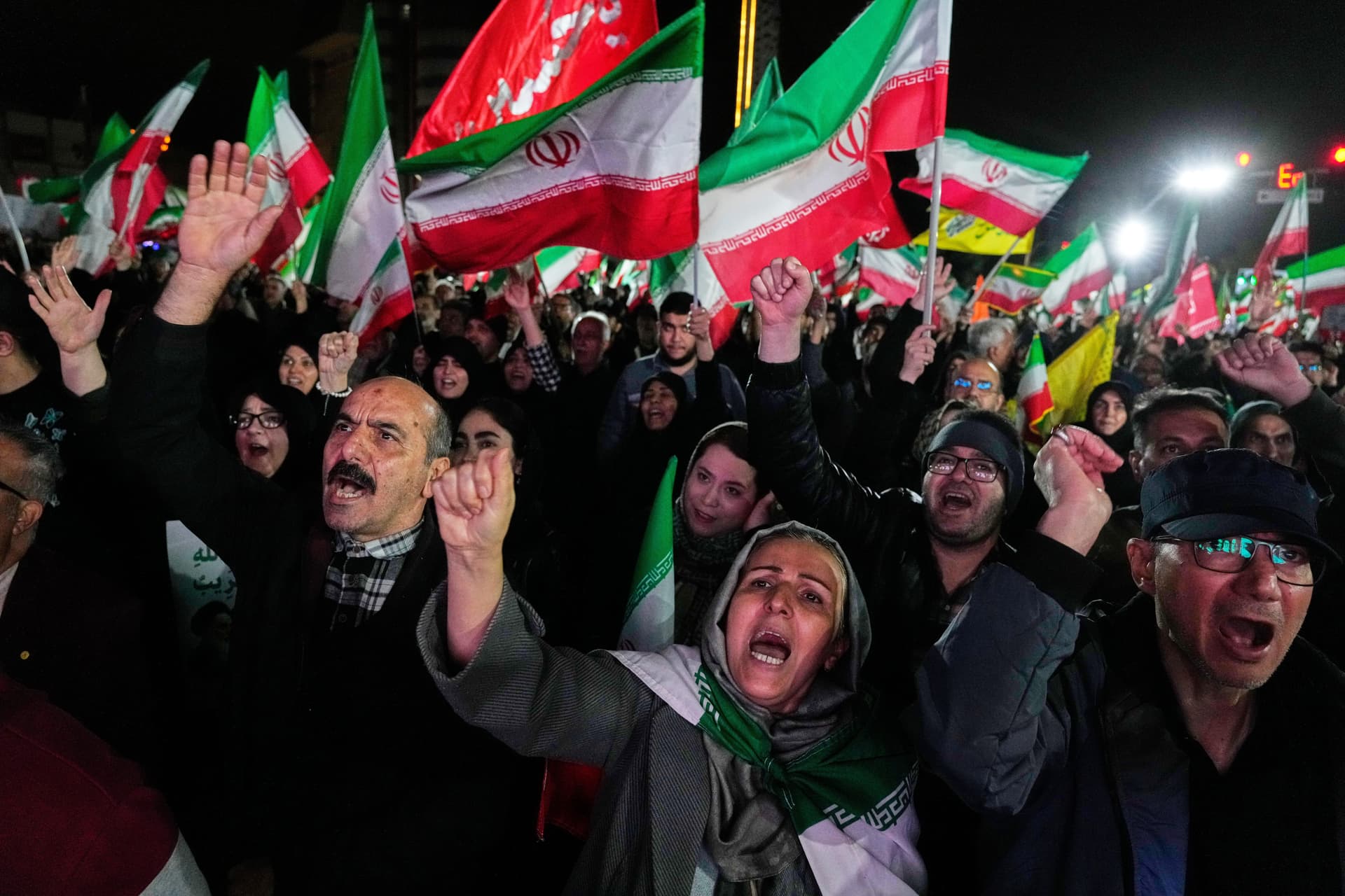 Vahid Salemi/AP Pro-government supporters chant slogans and wave Iranian flags during a rally at Tehran, Iran, on March 25, 2026.