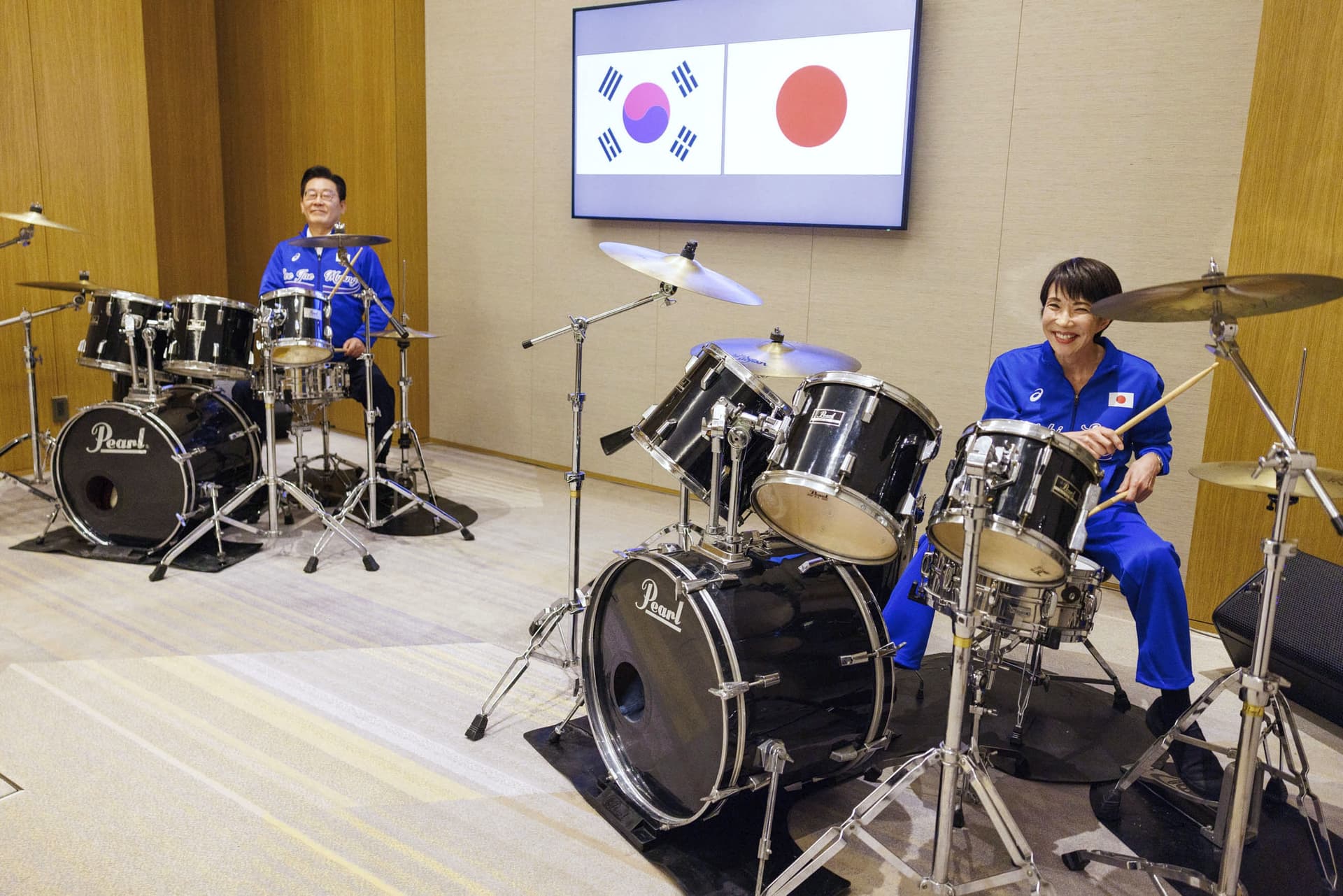 Prime Minister's Office of Japan via AP Prime Minister Sanae Takaichi, right, and President Lee Jae Myung of South Korea play drums at Nara, Japan, January 13, 2026.