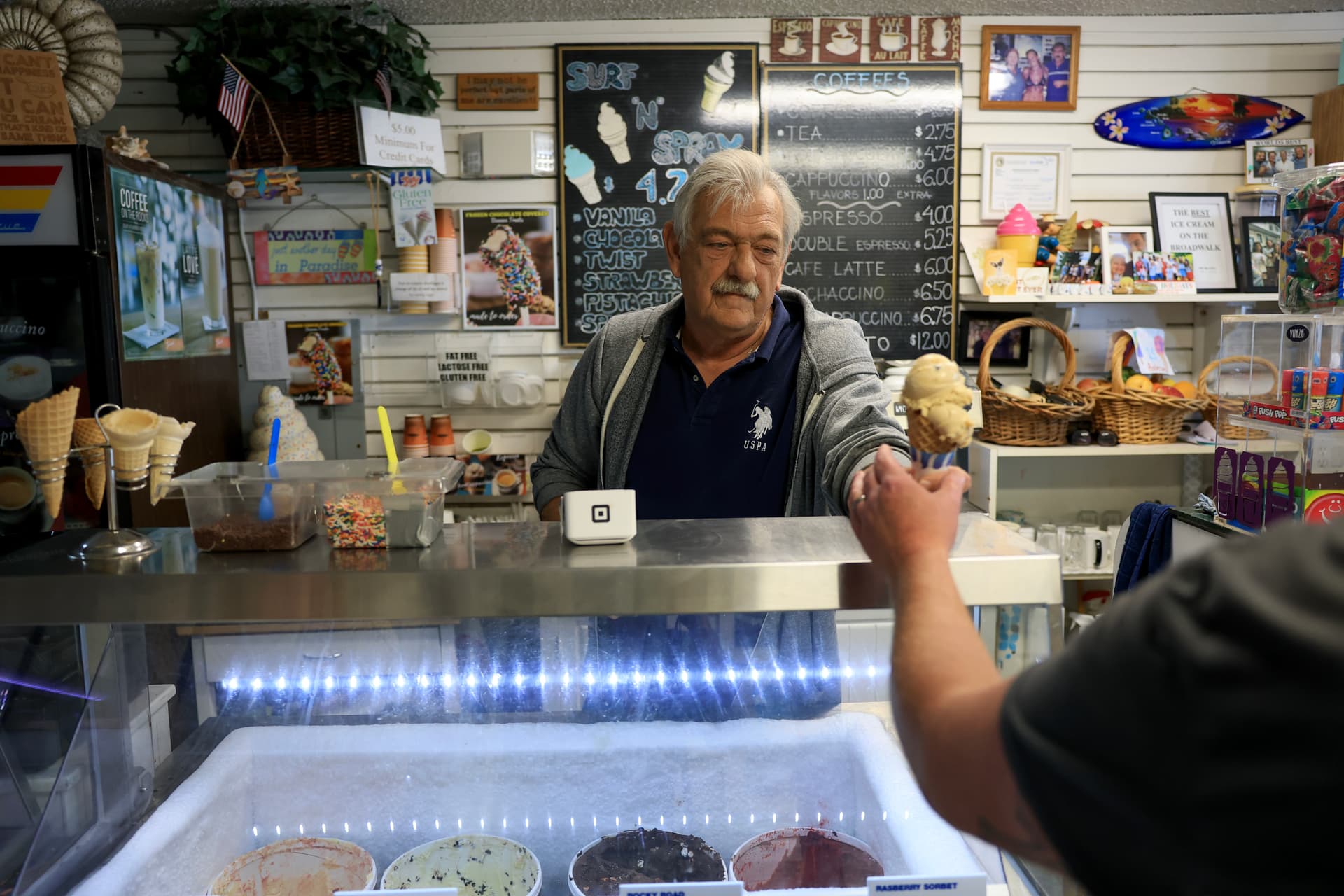 Joe Raedle/Getty Images Don Vaskovic works at his Surf and Spray ice cream shop on February 10, 2026 in Hollywood, Florida. Hollywood, also known as the 'Quebec of the South,' has seen fewer French-Canadian tourists.