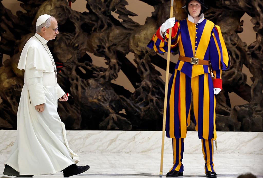 Mario Tama/Getty Images Pope Leo XIV walks past a Swiss guard while arriving to hold an audience on May 12, 2025 at Vatican City.