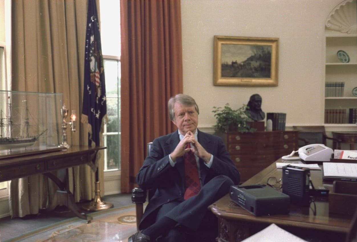 Via Wikimedia Commons President Carter at the Oval Office, December 13, 1977.