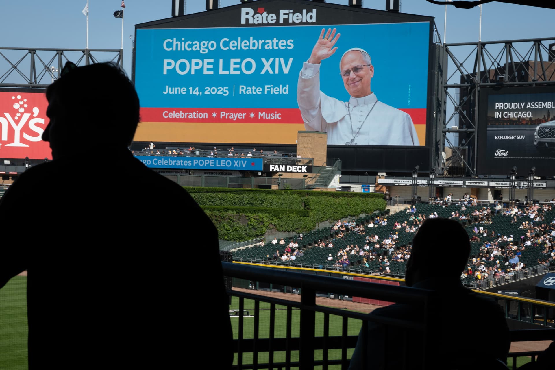 Scott Olson/Getty Images Guests attend mass at Rate Field, home to the Chicago White Sox, to celebrate the election of Pope Leo XIV on June 14, 2025.