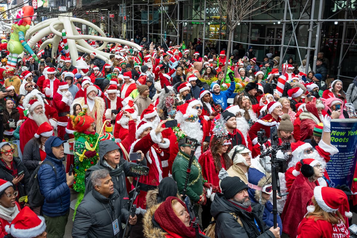 Jeremy Weine/Getty Images Revelers in holiday character costumes take part in the SantaCon bar crawl on December 13, 2025, at New York City.