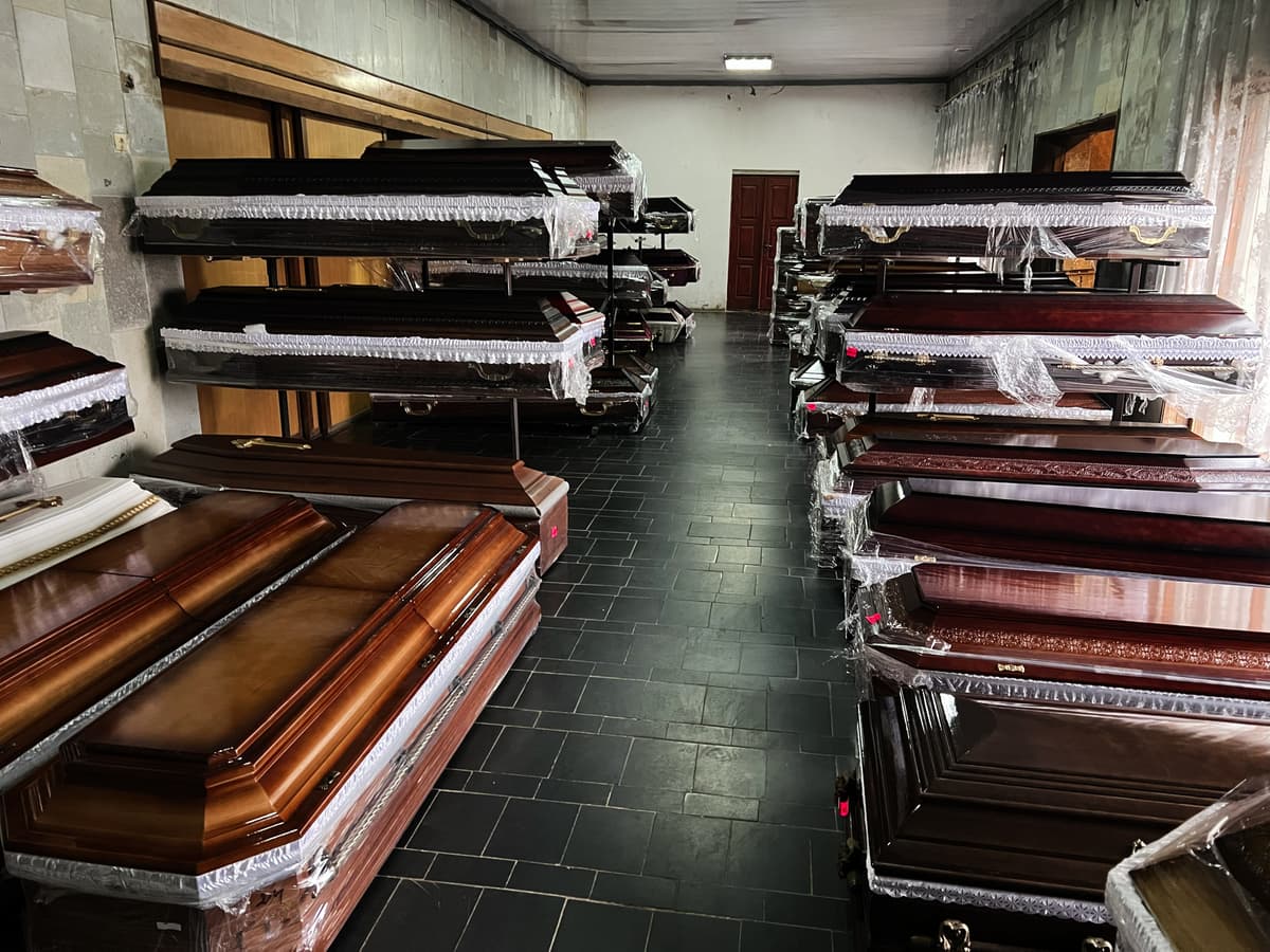 Getty Images Caskets on display in a showroom.