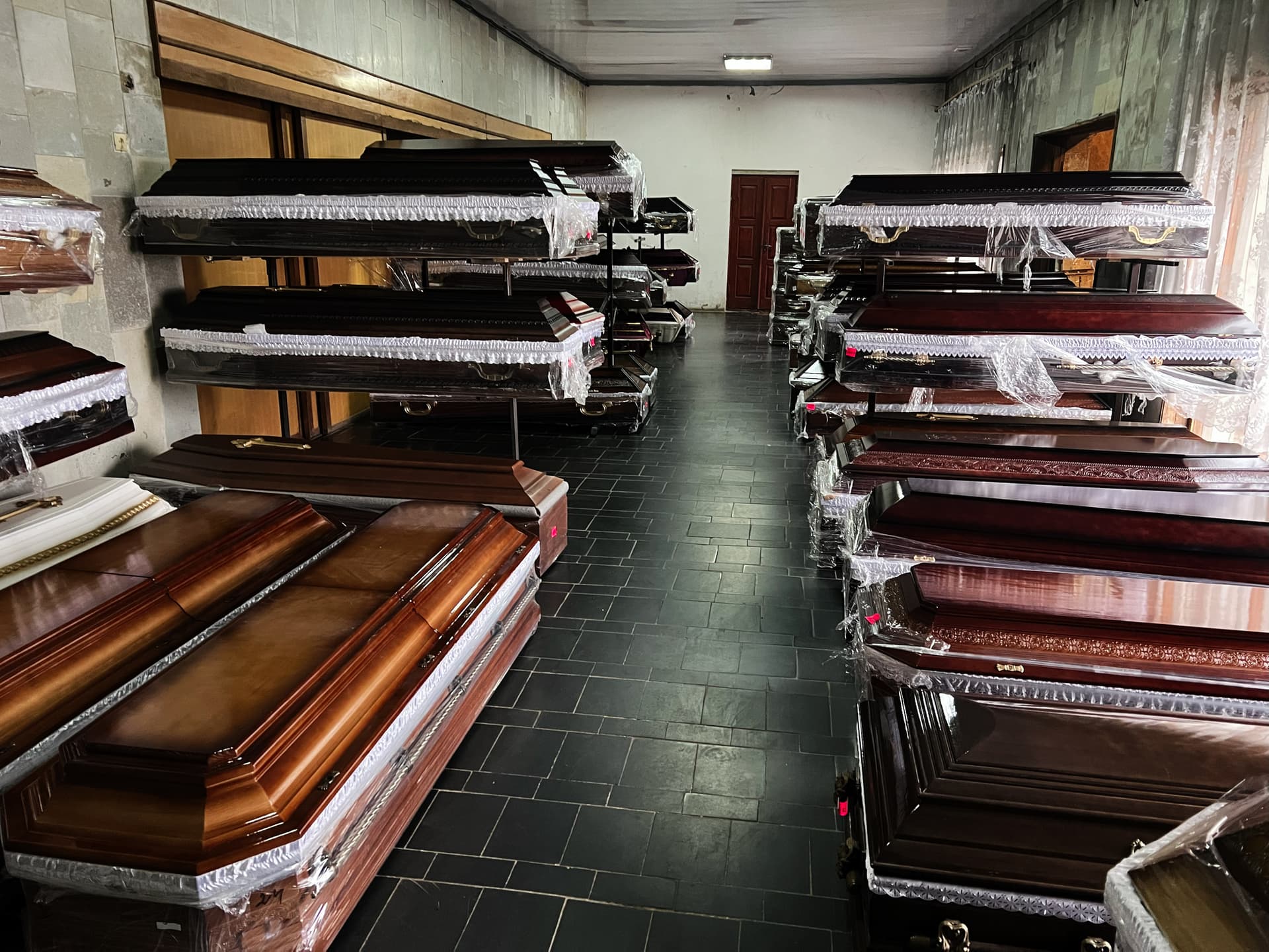 Getty Images Caskets on display in a showroom.
