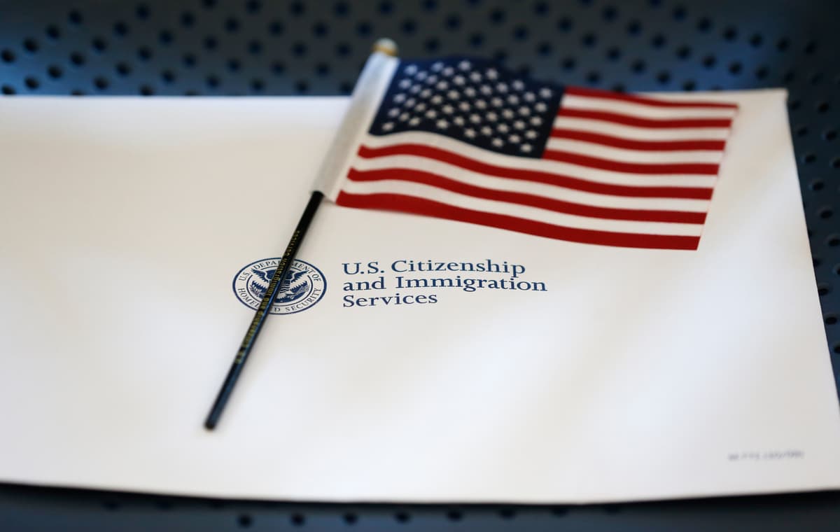Wilfredo Lee/AP An information packet and an American flag are seen at the U.S. Citizenship and Immigration Services field office at Miami on August 17, 2018.