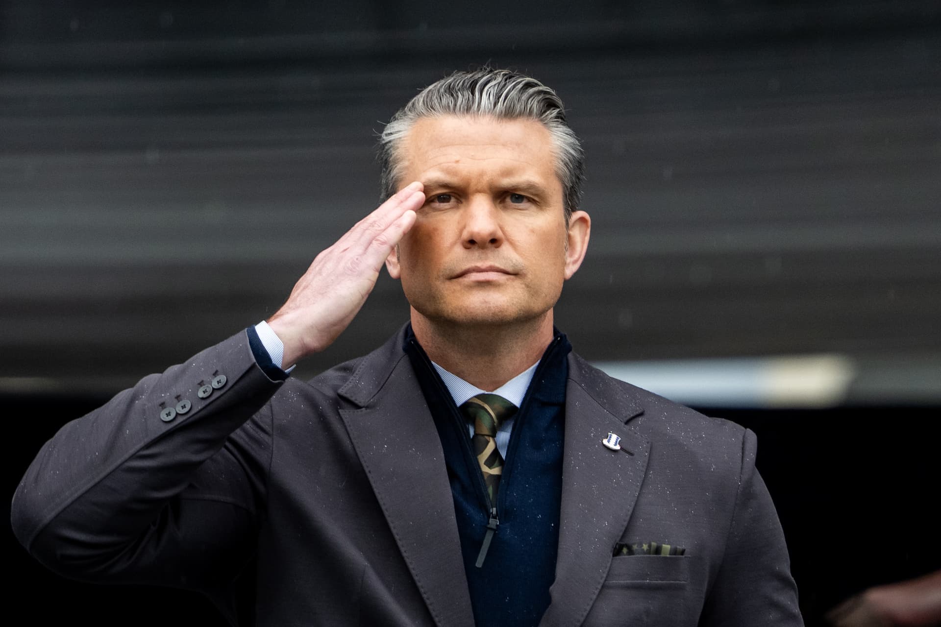 Adam Gray/Getty Images Pete Hegseth salutes graduating cadets during the United States Military Academy commencement.