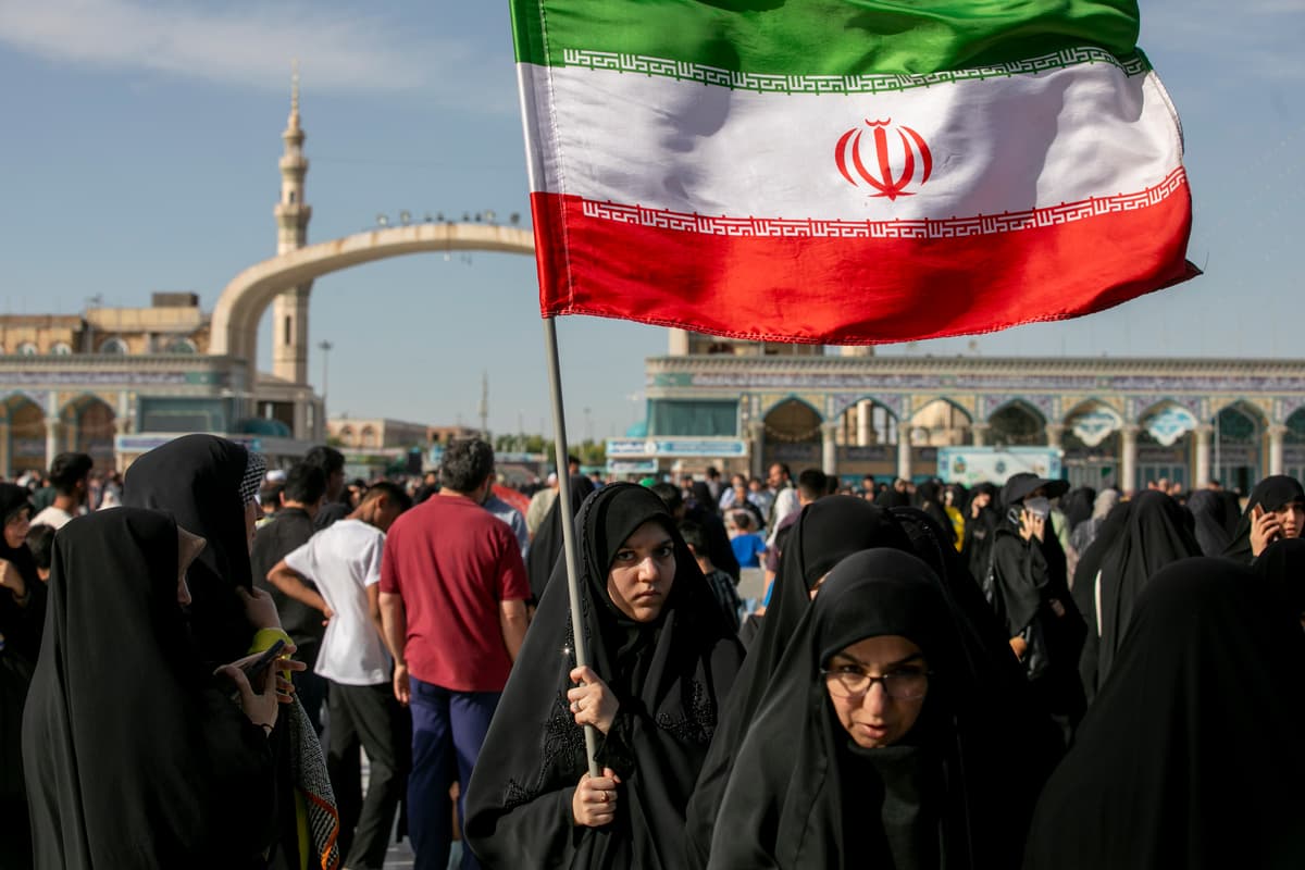 Photo by Majid Saeedi/Getty Images A woman is seen carrying an Iranian flag during Eid al-Adha on May 26, 2026, at Qom, Iran. Eid al-Adha — the Festival of Sacrifice —is one of the most sacred holidays in Islam and marks the conclusion of the annual Hajj pilgrimage to Mecca.