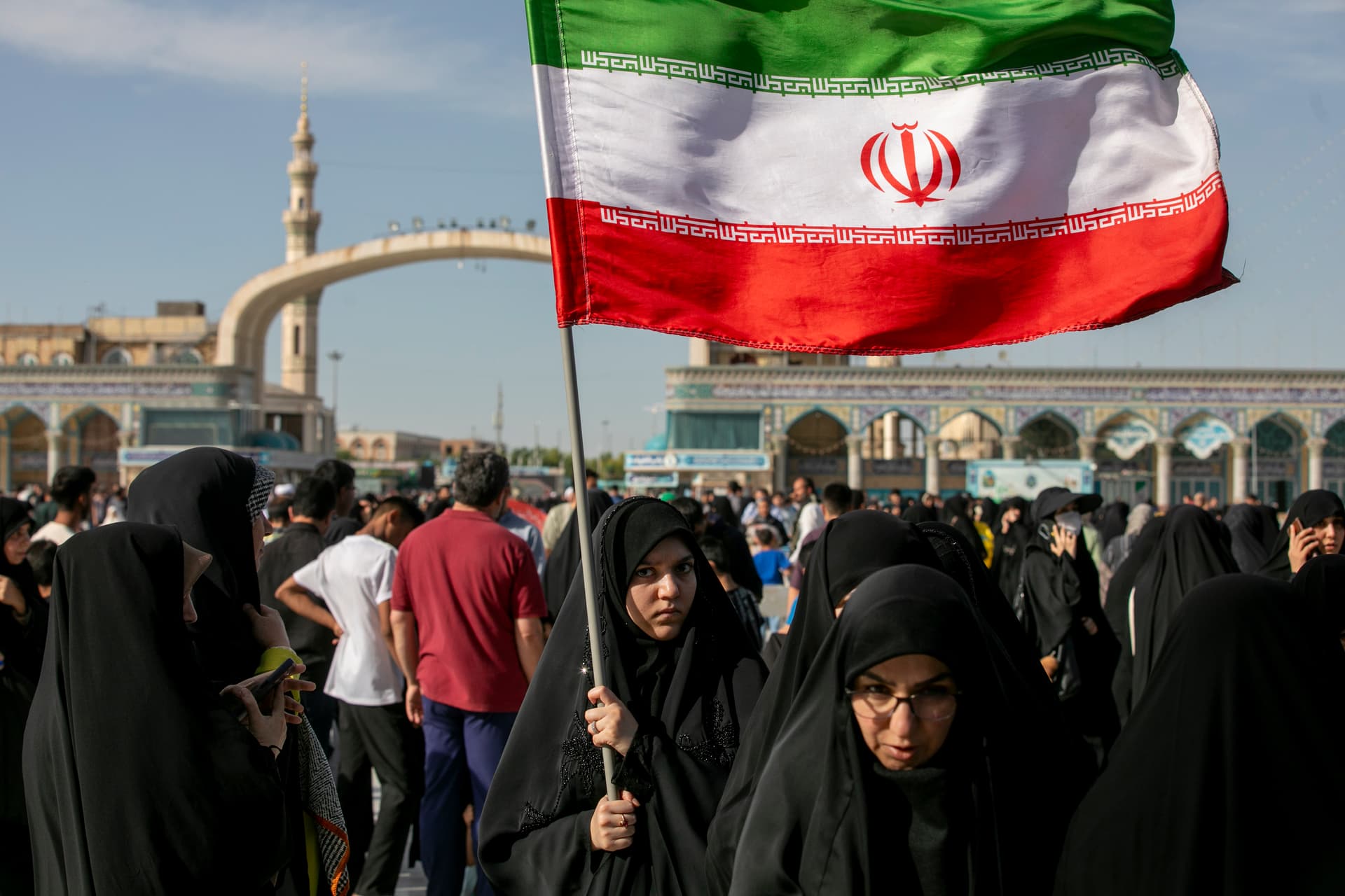 Photo by Majid Saeedi/Getty Images A woman is seen carrying an Iranian flag during Eid al-Adha on May 26, 2026, at Qom, Iran. Eid al-Adha — the Festival of Sacrifice —is one of the most sacred holidays in Islam and marks the conclusion of the annual Hajj pilgrimage to Mecca.