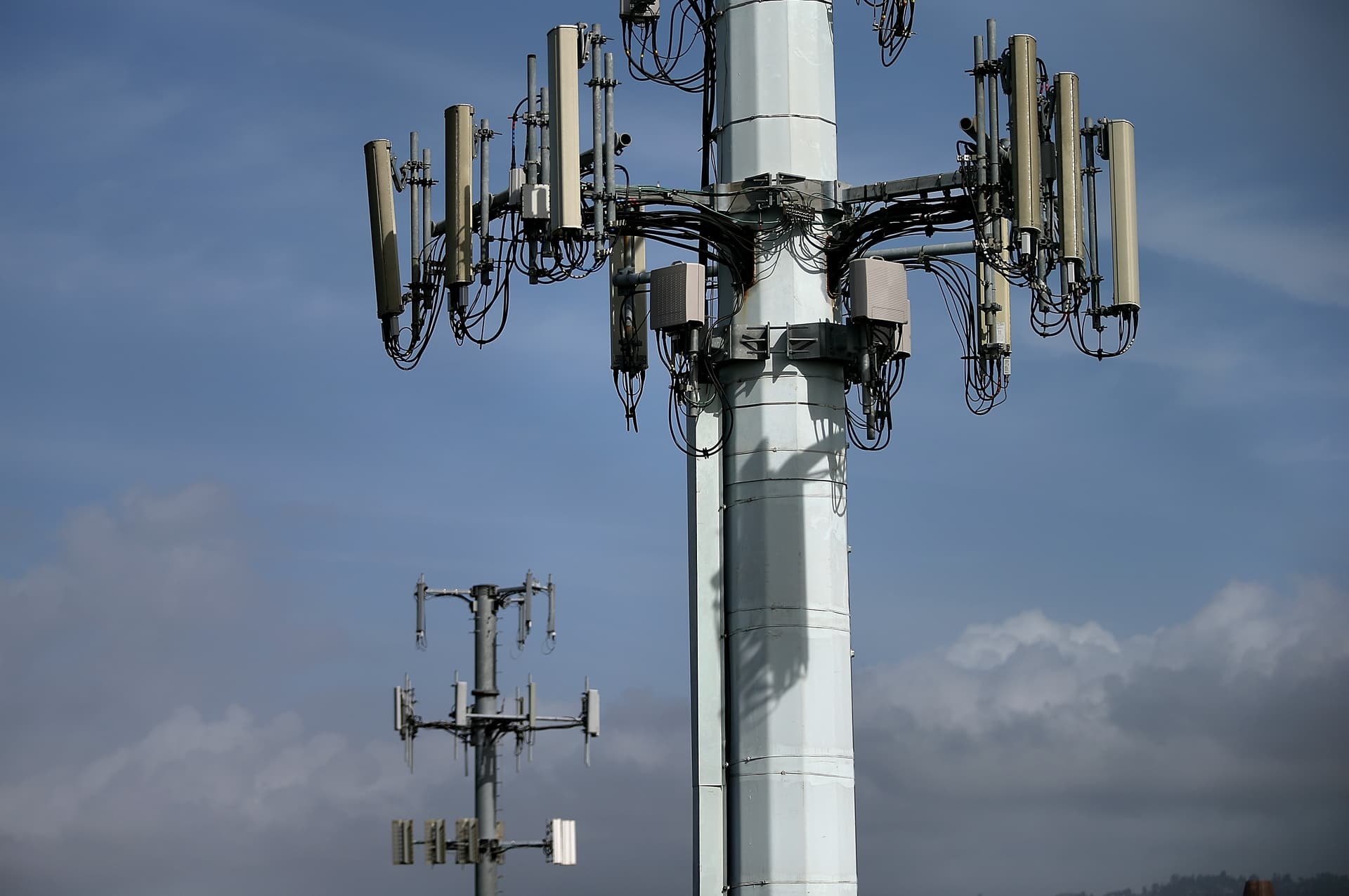 Justin Sullivan/Getty Images AT&T, T-Mobile, and Verizon will launch a joint venture to boost cell phone coverage by using satellite-based technologies.