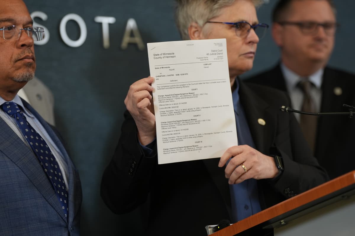 Renée Jones Schneider/Minnesota Star Tribune via AP Hennepin County attorney Mary Moriarty holds up a document containing charges against ICE agent Christian Castro during a news conference at the Hennepin County Government Center in Minneapolis, May 18, 2026.