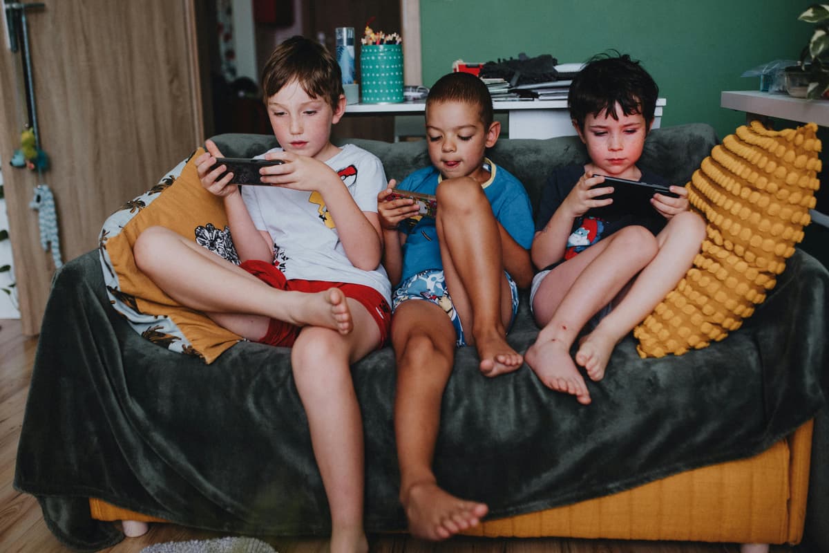 Photo by Helena Jankovičová Kováčová via Pexels.com Kids on their cellphones.