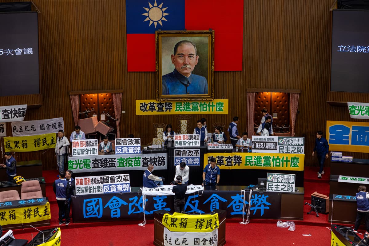 Annabelle Chih/Getty Images Lawmakers protest under a portrait of Sun Yat-sen in the Free Chinese parliament, the Legislative Yuan, on May 24, 2024.