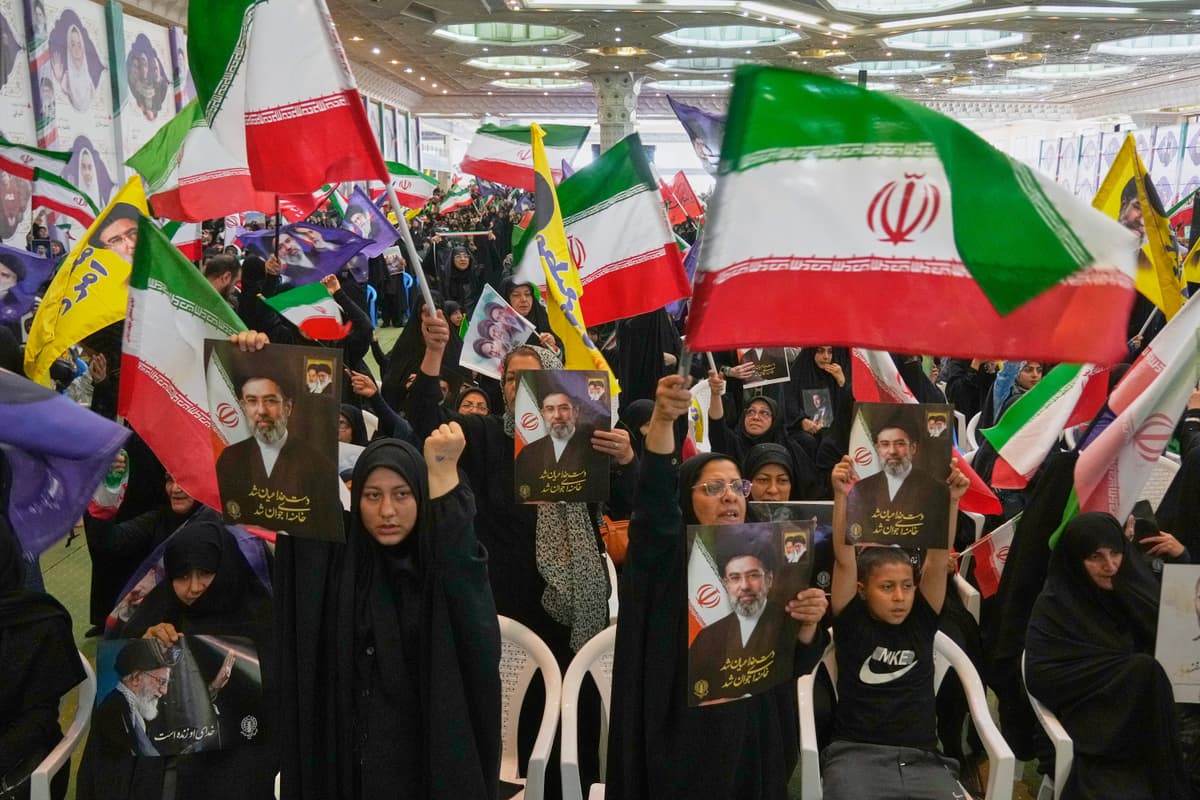 AP/Vahid Salemi Iranians carry flags and pictures of Iran's Supreme Leader, Ayatollah Mojtaba Khamenei, at Tehran, May 24, 2026.