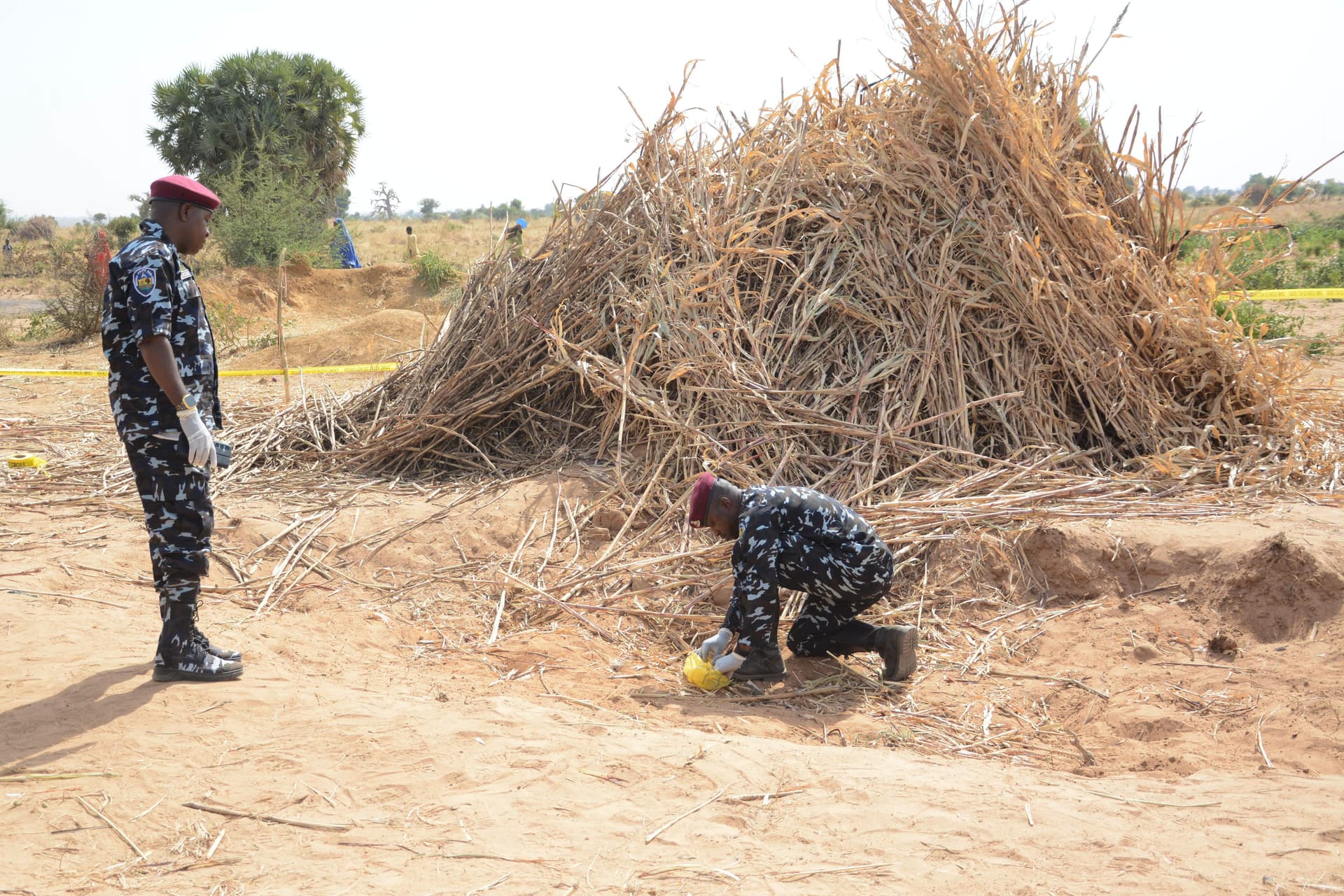 AP/Tunde Omolehin Police Anti-Bomb squad inspect the site of a U.S. airstrike in Northwest, Jabo, Nigeria, December 26, 2025.