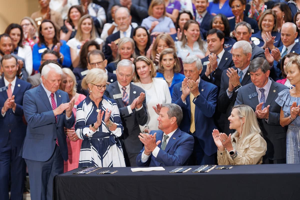 Georgia House of Representatives via Facebook. Georgia lawmakers join Governor Brian Kemp as he signs legislation into state law on May 8, 2026, in the General Assembly at Atlanta.