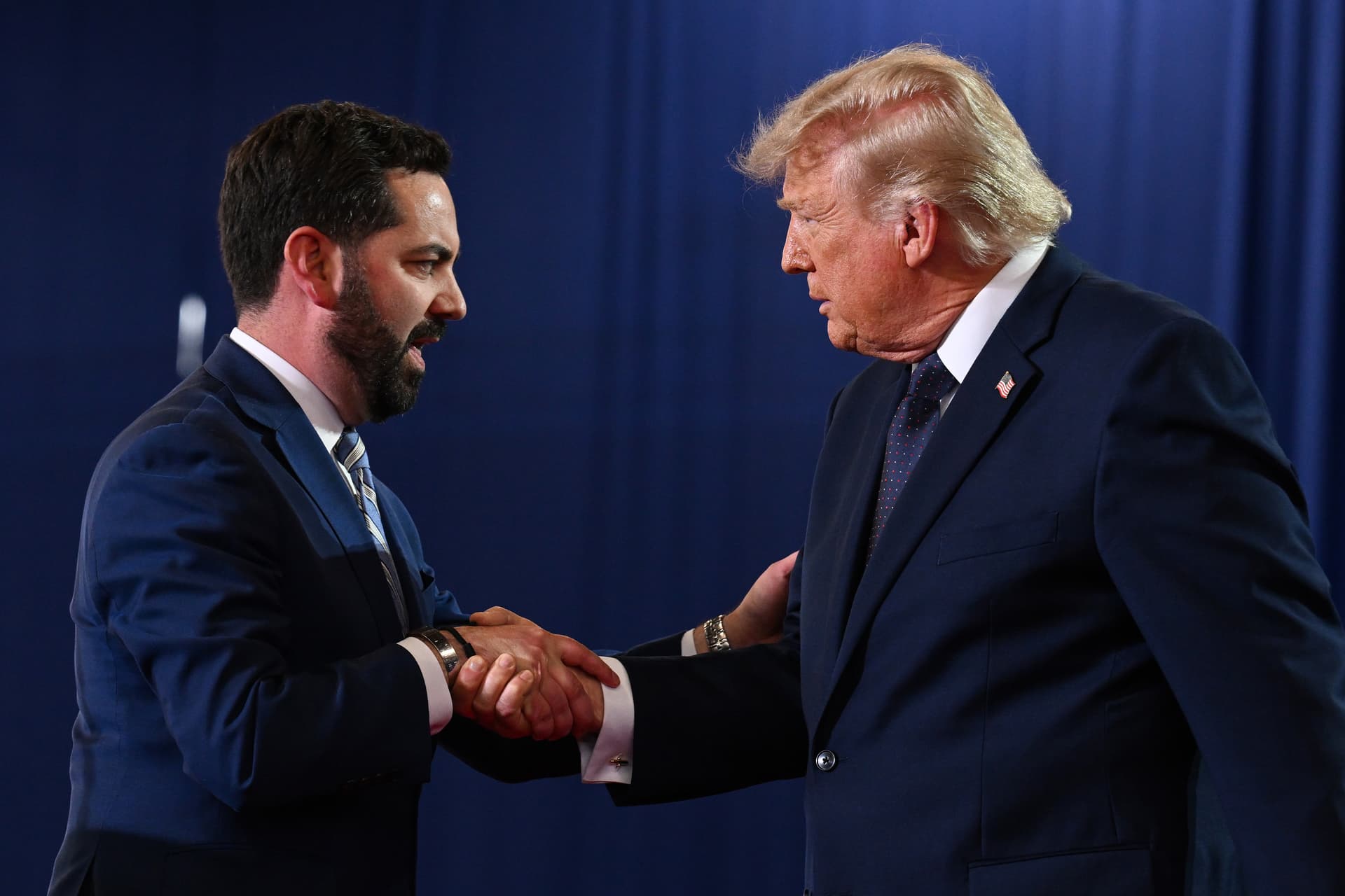 Roberto Schmidt/Getty Images Congressman Mike Lawler shakes hands with President Trump as he arrives to speak during a campaign and economic policy event in the Eugene Levy Fieldhouse at SUNY Rockland Community College on May 22, 2026 at Suffern, New York.