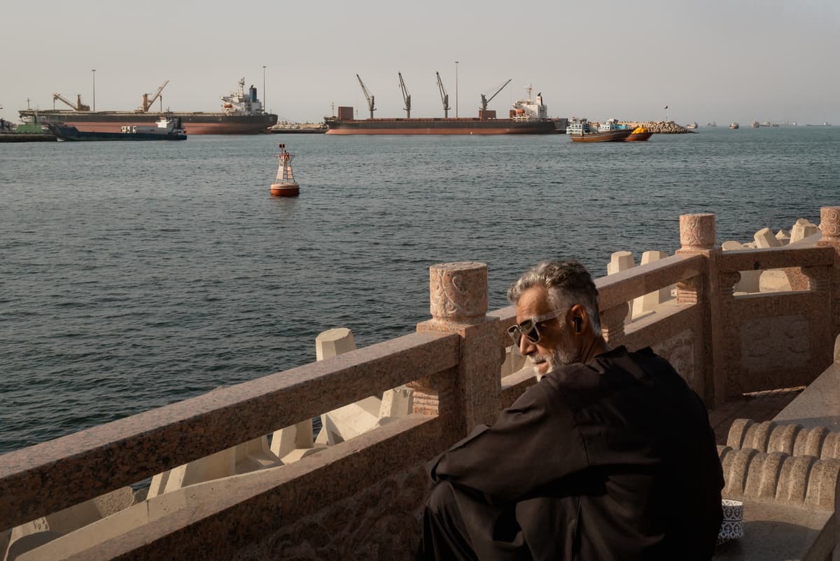 Elke Scholiers/Getty Images A man looks on as oil tankers and other vessels sit anchored in the waters off Muscat near the Strait of Hormuz on June 18, 2026.