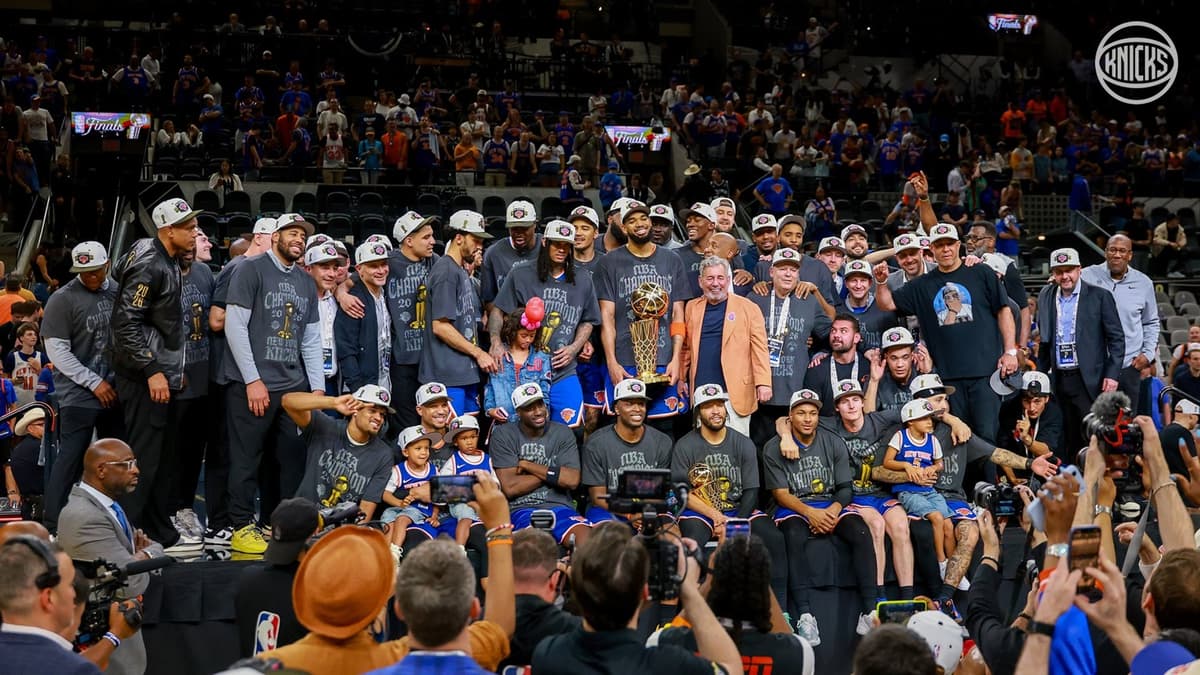 New York Knicks via X Knicks team members and staff and their families pose for a photo after winning the championship for the first time since 1973.