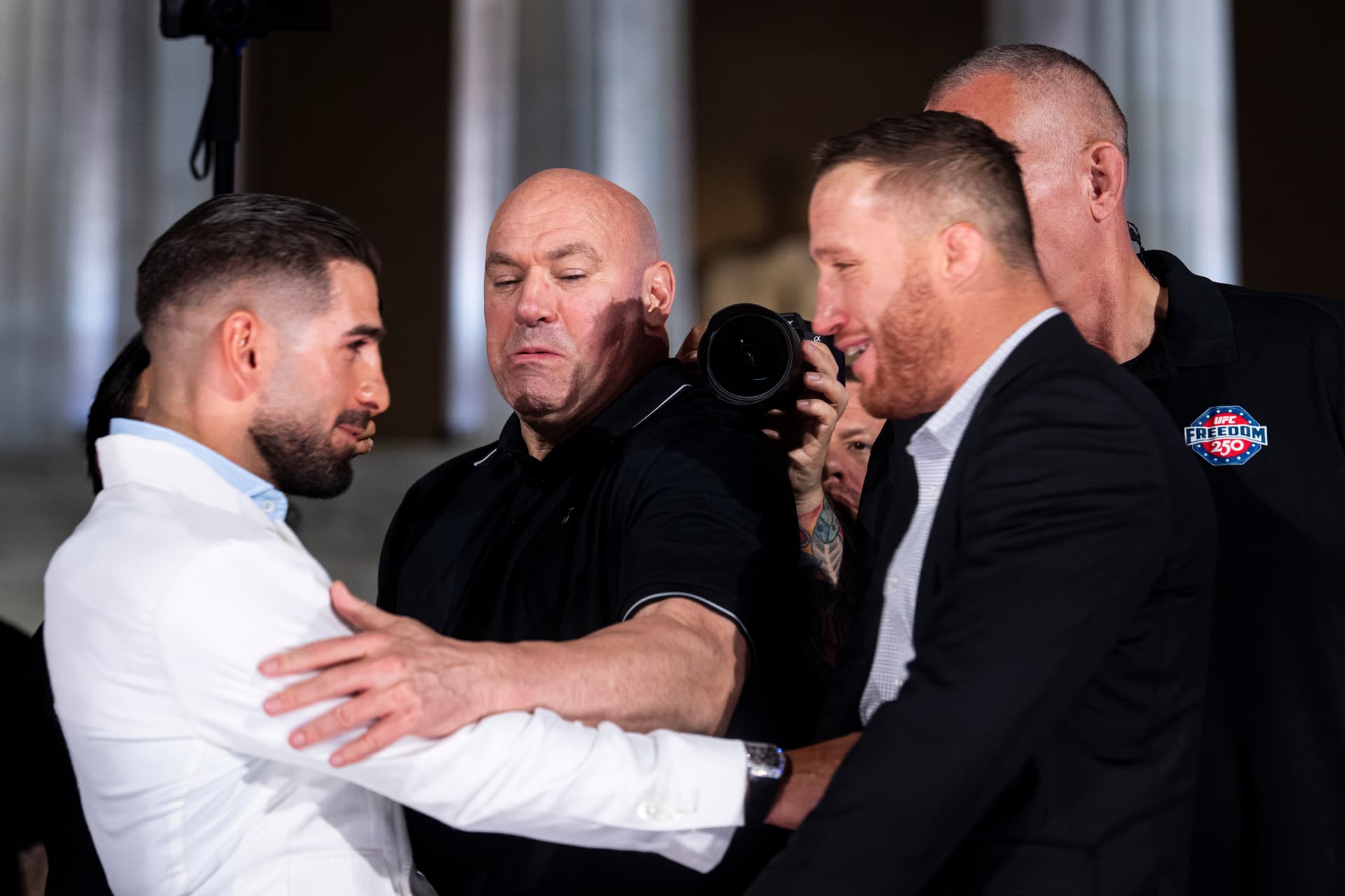 Al Drago/Getty Images The UFC CEO, Dana White, separates lightweight fighters Ilia Topuria and Justin Gaethje as they face off during a press conference at the Lincoln Memorial at Washington, D.C., on June 12, 2026.
