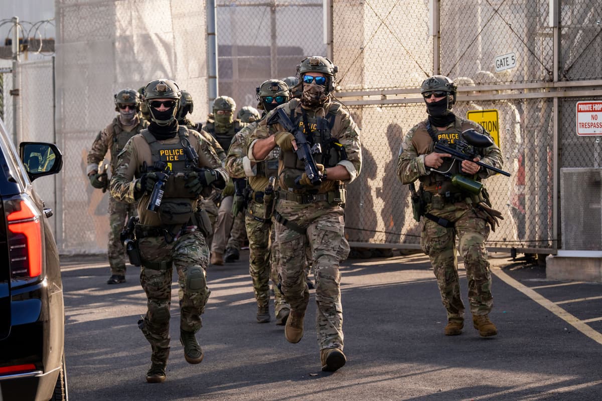 Adam Gray/Getty Images Immigration and Customs Enforcement (ICE) agents run out of Delaney Hall Immigration Detention Center as they protect vehicles during a shift change on June 7, 2026 in Newark, New Jersey.
