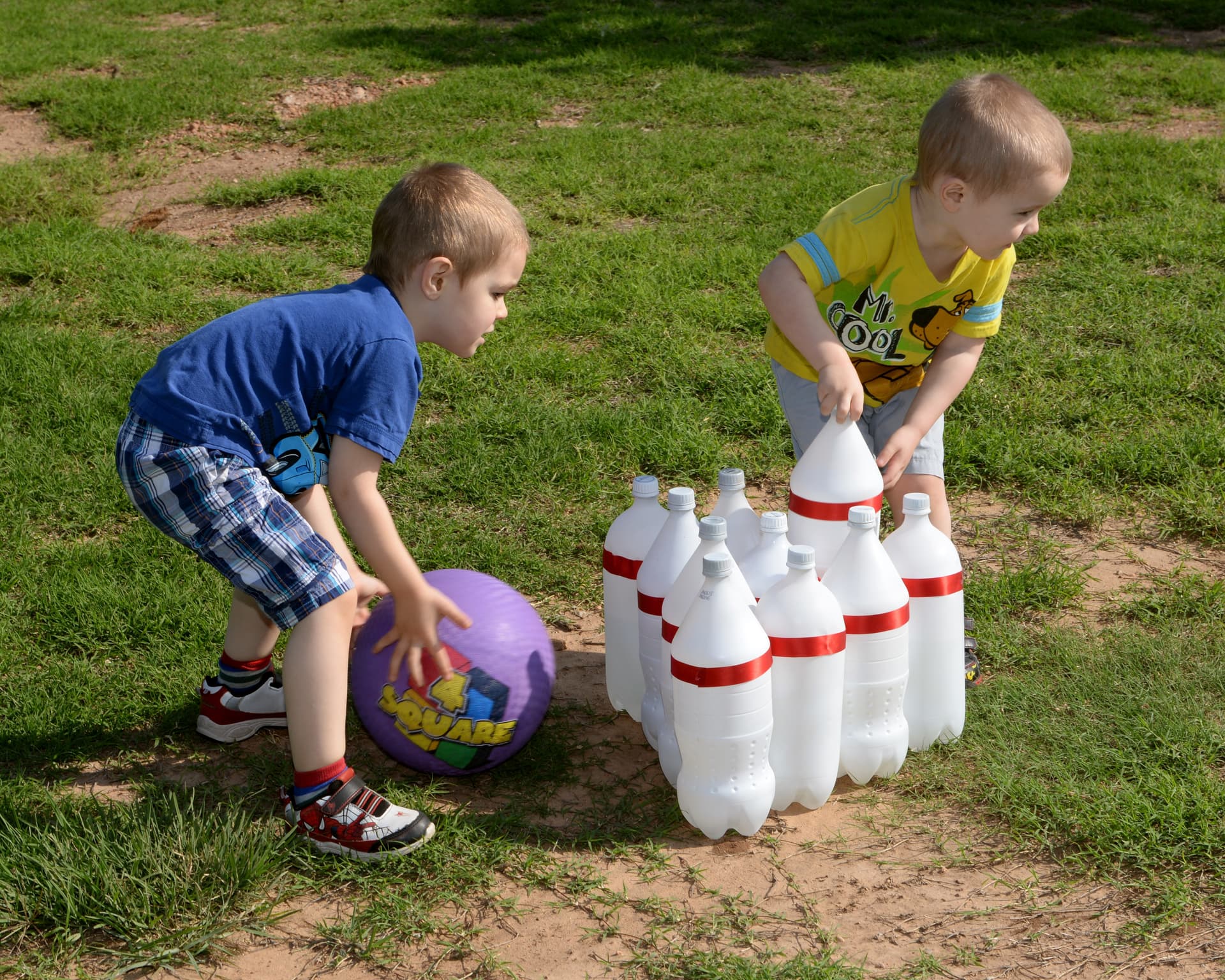 Megan Myhre via DVIDS Children play with soda bottles made of PET.