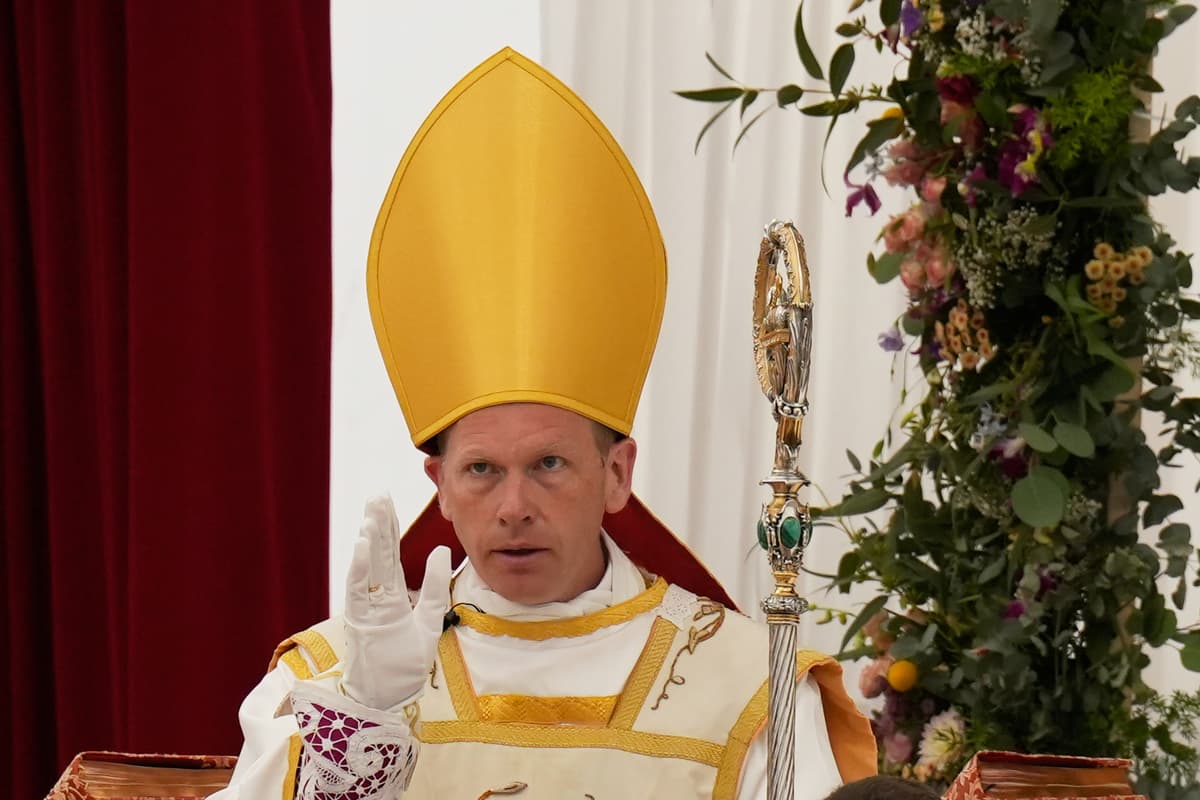 AP/Baz Ratner Newly consecrated Bishop Michael Goldade delivers his blessing at the end of his consecration ceremony at the Society of St. Pius X seminary at Econe, Switzerland, July 1, 2026.