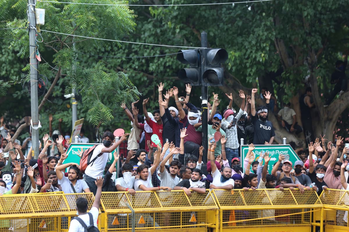 Vipin/AP Protesters react after India's education minister, Dharmendra Pradhan, resigned in response to protests led by the Cockroach Janta movement at New Delhi on July 25, 2026.