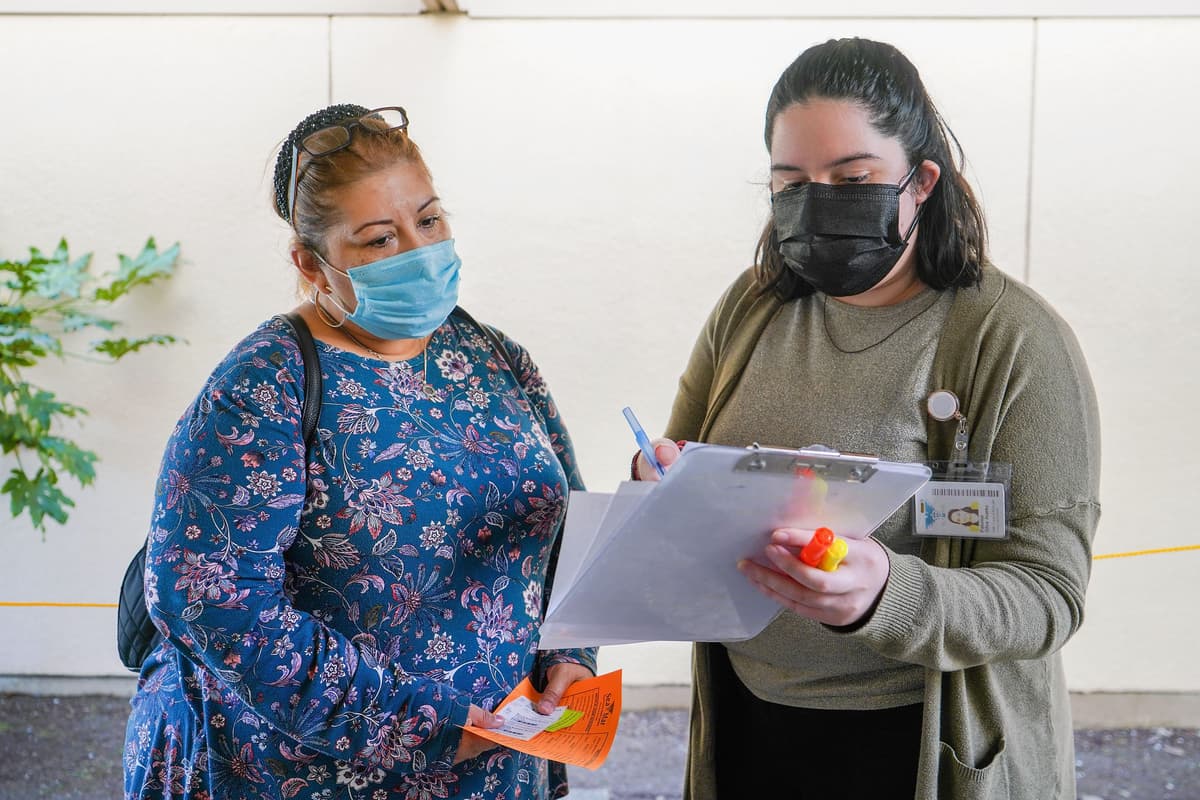 Suzi Pratt/Getty Images A woman signs up for a cervical cancer screening in Burien, Washington.
