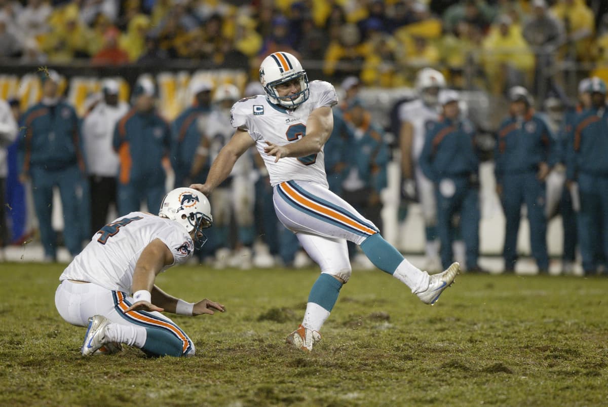 George Gojkovich/Getty Images Kicker Jay Feely of the Miami Dolphins follows through on a failed field goal attempt as holder Brandon Fields remains kneeling during a game against the Pittsburgh Steelers at Heinz Field on November 26, 2007.