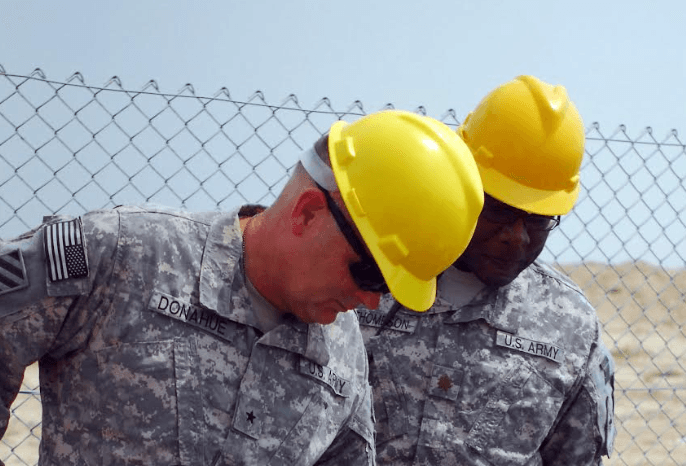 Via DVIDS Officers inspect waste destined for a burn pit in Kirkuk, Iraq.