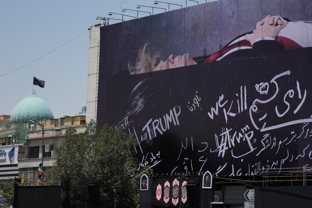 Vahid Salemi/AP A billboard depicting President Trump lying on what appears to be a coffin and bearing anti-Trump messages is seen at Islamic Revolution Square at Tehran, Iran, on July 15, 2026.