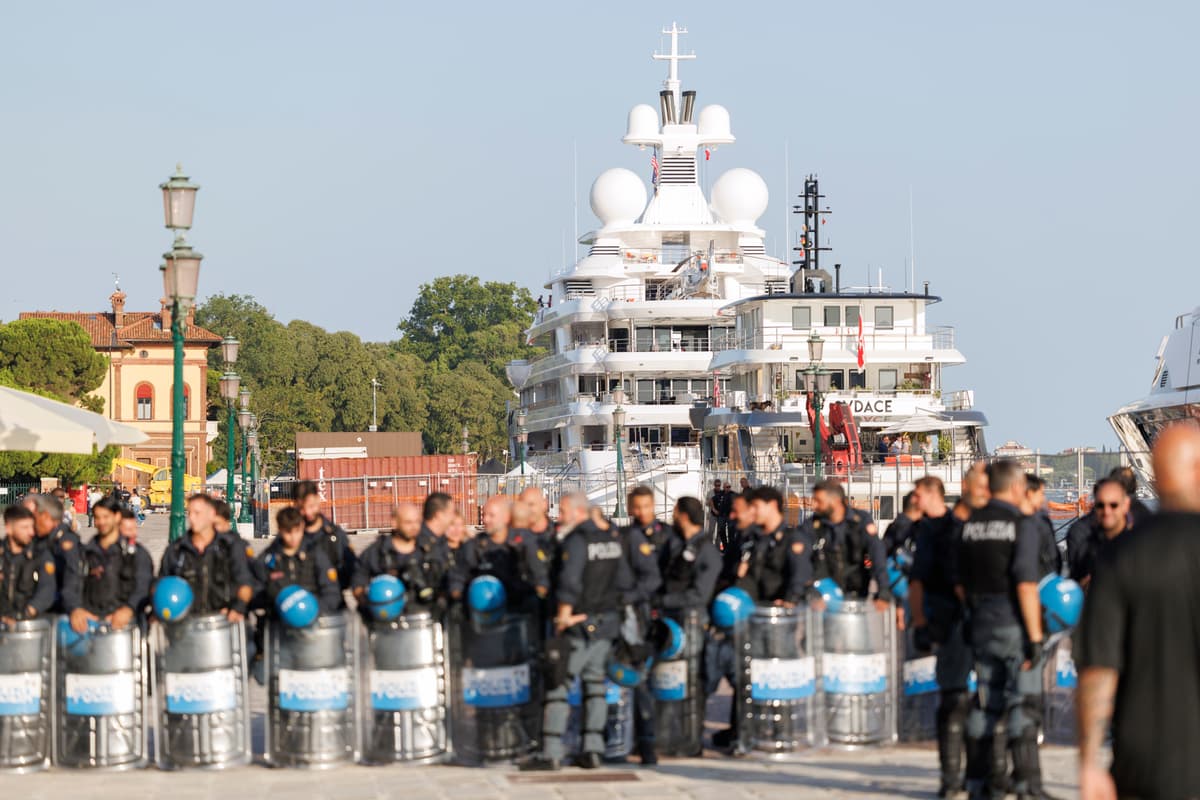 Stefano Mazzola/Getty Images Police officers stand guard in front of a 385-foot superyacht owned by America’s ambassador to Italy as it docks during a diplomatic visit to Venice on July 17, 2026.