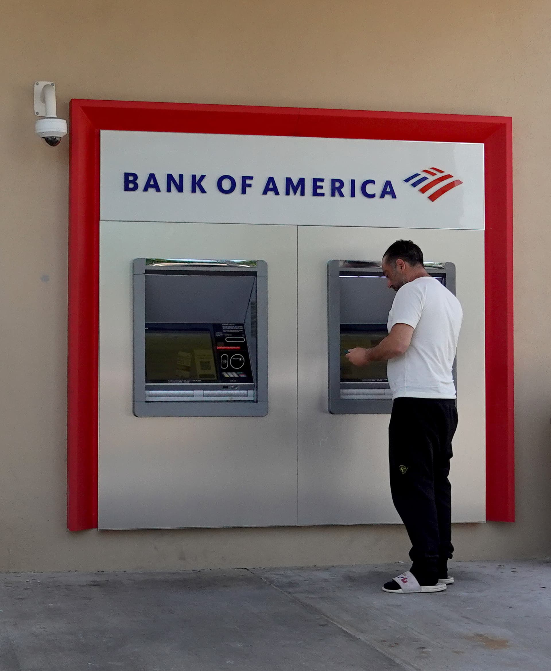 Joe Raedle/Getty Images A customer withdraws cash from an ATM machine at Miami, Florida, on July 18, 2022.