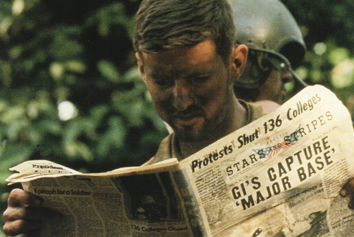 Via Wikimedia Commons An American soldier reading Stars and Stripes during the Cambodian Campaign.
