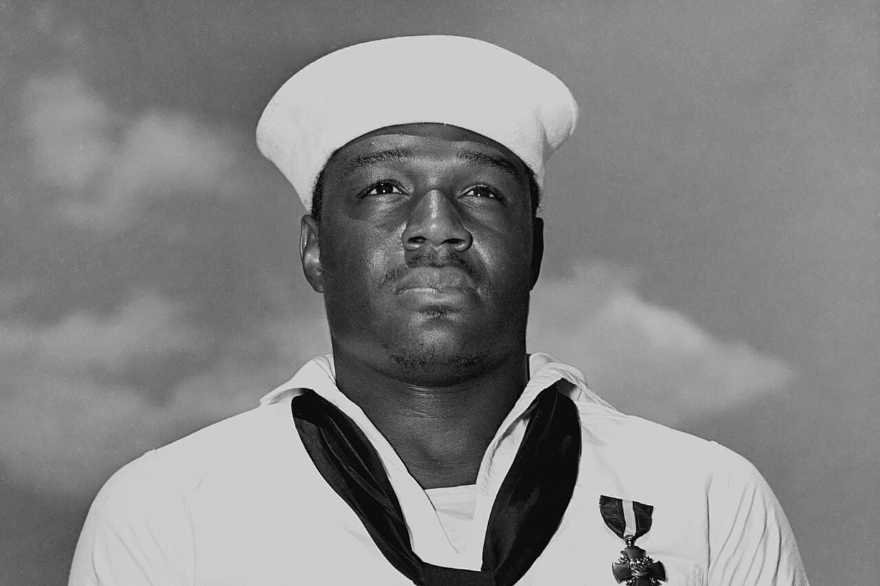 Via Wikimedia Commons Doris Miller with his Navy Cross on May 27, 1942.
