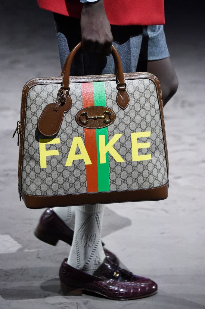 MILAN, ITALY - JANUARY 14: A model, bag detail, walks the runway at the Gucci show during Milan Menswear Fashion Week Fall/Winter 2020/21 on January 14, 2020 in Milan, Italy. (Photo by Pietro S. D'Aprano/Getty Images for Gucci) Featured image for True Luxury Means Far More Than a Logo