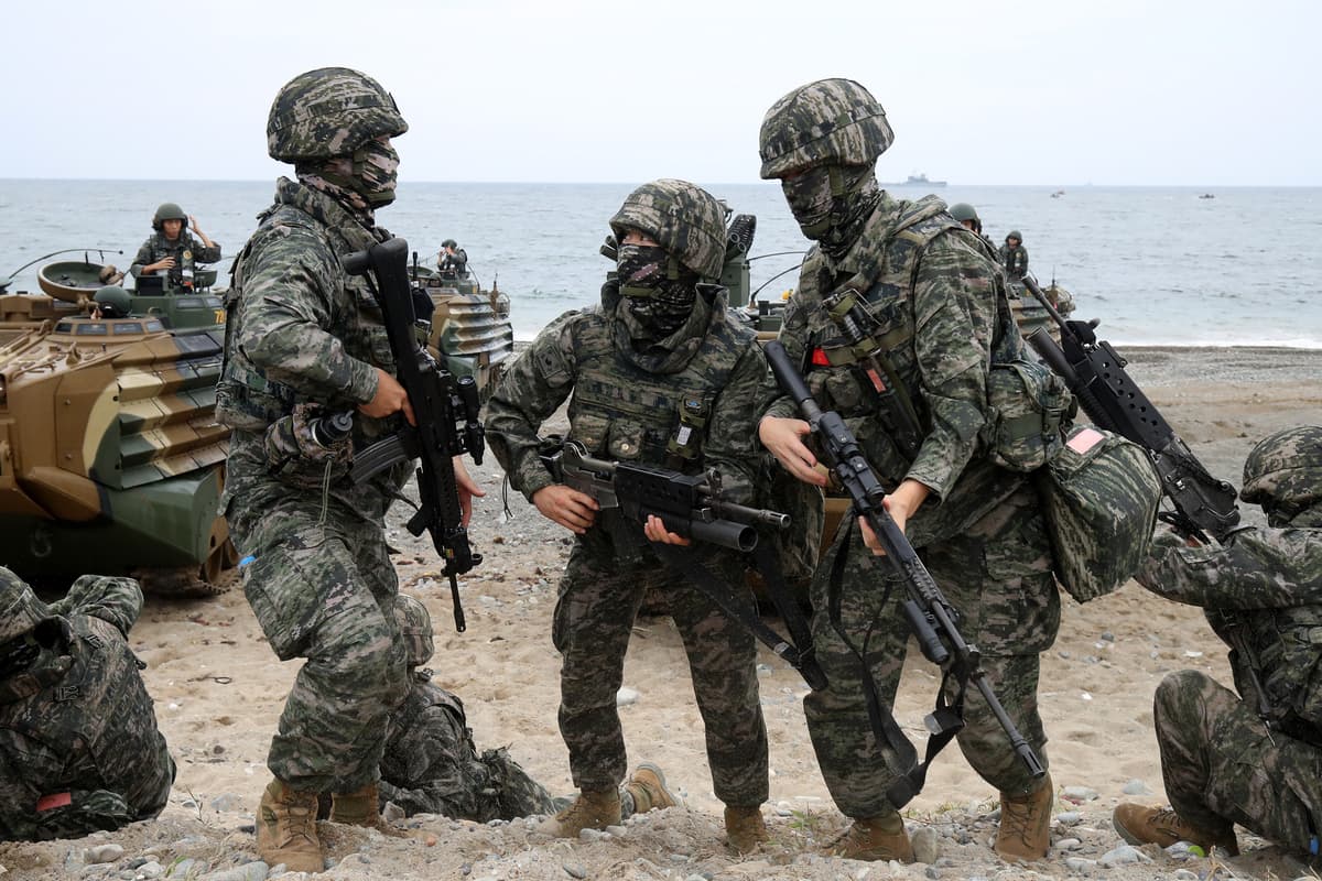 Chung Sung-Jun/Getty Images South Korean marines participate in the Ssangyong (double dragon) exercise at Pohang seashore on September 2, 2024.