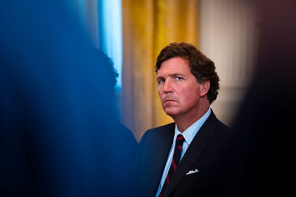 Al Drago/Getty Images Tucker Carlson attends a meeting at the East Room of the White House on January 9, 2026.