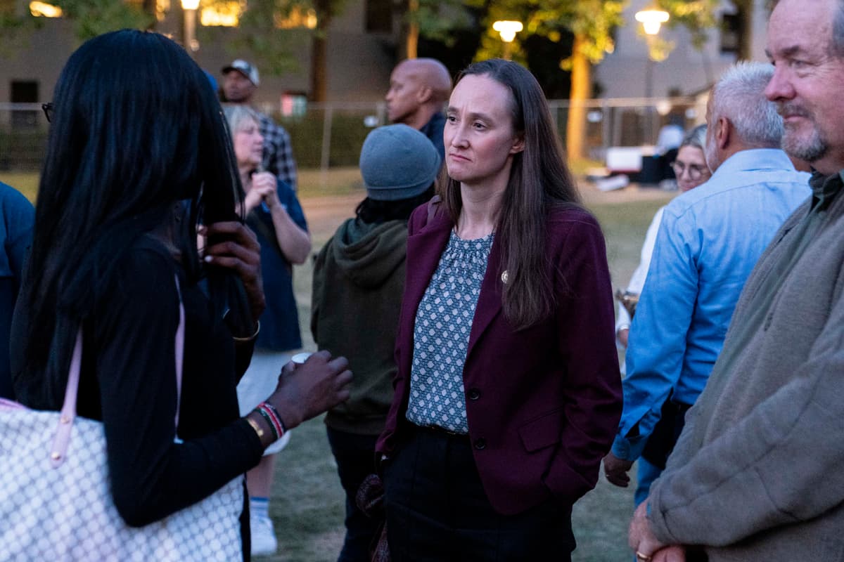 David Ryder/Getty Images Seattle Mayor Katie Wilson listens to an attendee after a vigil a day after the Bite of Seattle food festival shooting at Seattle Center on July 27, 2026, at Seattle, Washington.