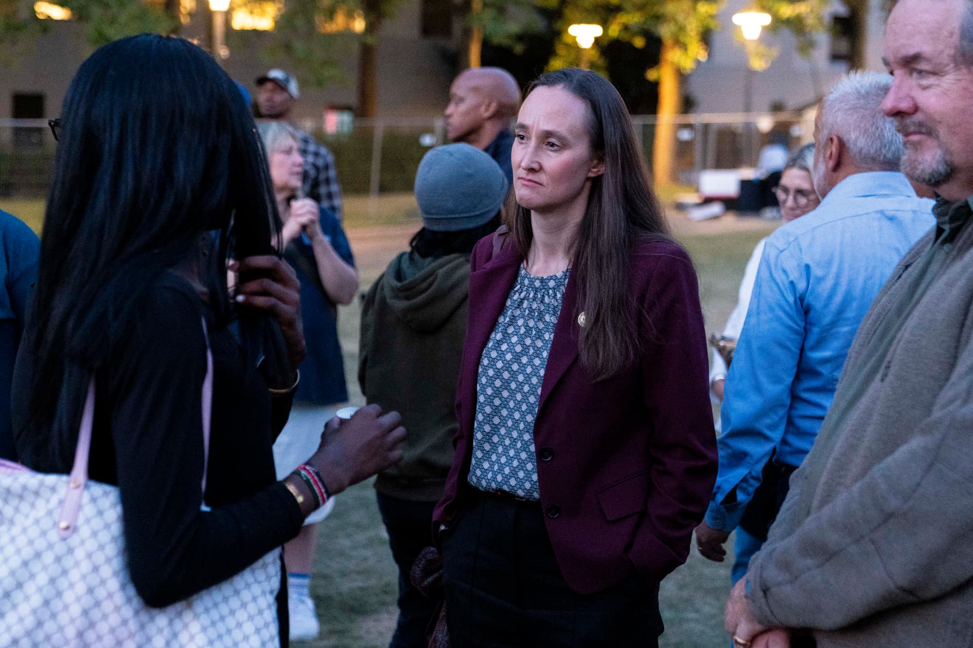 David Ryder/Getty Images Seattle Mayor Katie Wilson listens to an attendee after a vigil a day after the Bite of Seattle food festival shooting at Seattle Center on July 27, 2026, at Seattle, Washington.